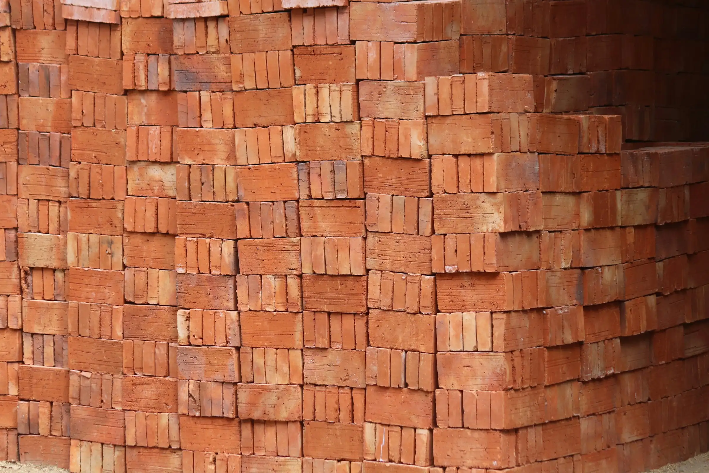 Stacks of red clay bricks